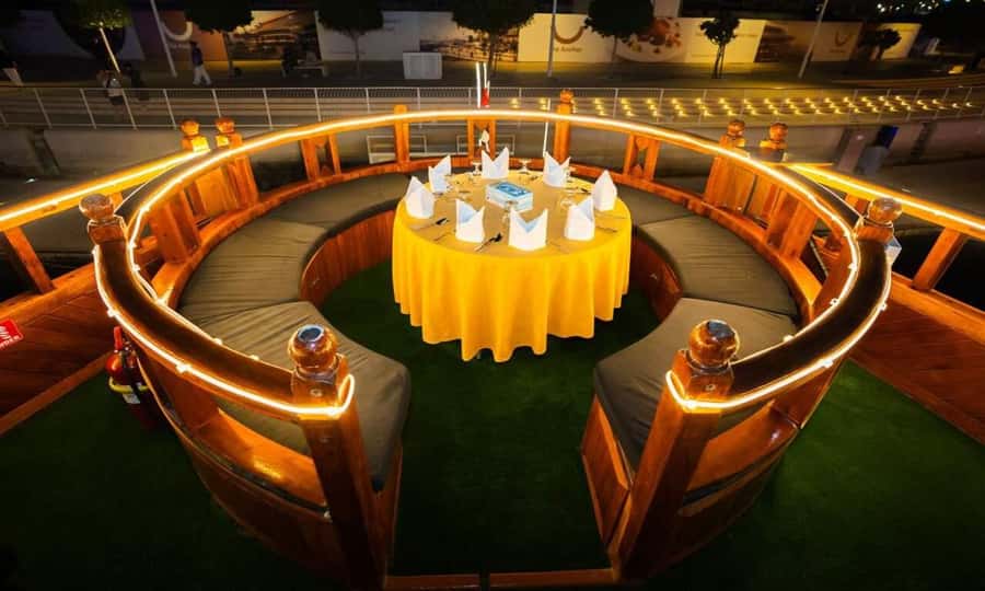 5-Star Marina Dhow Dinner Cruise With Live Entertainment - A traditional-style dhow with a modern Dubai view