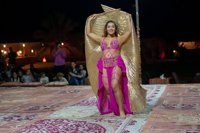 Abu Dhabi: 7-Hours Desert Safari with BBQ, Camel Ride & Sandboarding - A carpeted camp with tea, drinks, and dinner