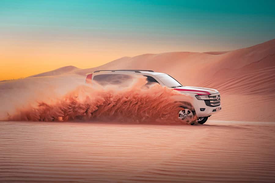 Abu Dhabi: Desert Safari with BBQ, Belly & Tannura Dance - Sunset pictures and the camel farm pass-by