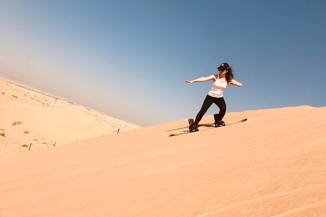 Abu Dhabi Desert safari with BBQ Dinner,Sandboarding & Camel ride - Dune bashing across Abu Dhabi’s rolling sand
