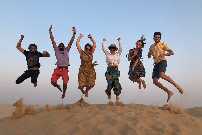 Abu Dhabi Desert Safari with BBQ Dinner & Shows - Sunset, sandboarding, and the camel stop
