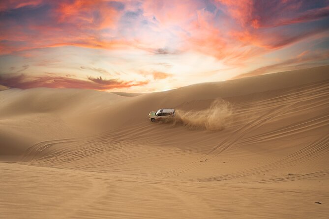 Abu Dhabi Morning Desert Safari: 4x4 Dune Bashing, Camel Ride and Sandboarding - Refreshments at the Bedouin-style camp