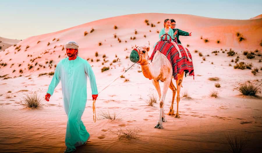 Abu Dhabi: Morning Dune Drive, Camel Ride & Sandboarding - Sandboarding is simple, fun, and harder than it looks