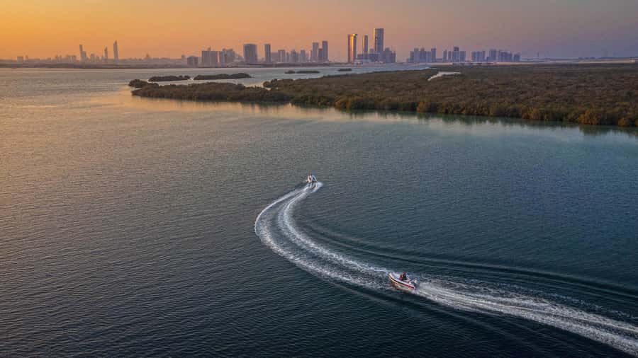 Abu Dhabi: Yas Island Self-Driving Guided Speedboat Tour - Peninsula Gold Beach and the possible swim stop