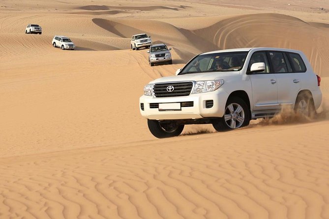 Best Dubai Desert Safari with Buffet Dinner,Sand Boarding & Shows - Sandboarding for a slower view