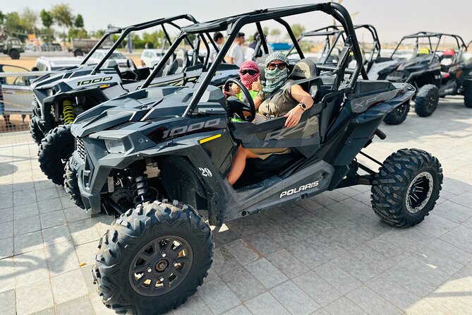 Best Dubai Desert Safari with Buffet Dinner,Sand Boarding & Shows - Dinner, tanoura, belly dance, and fire