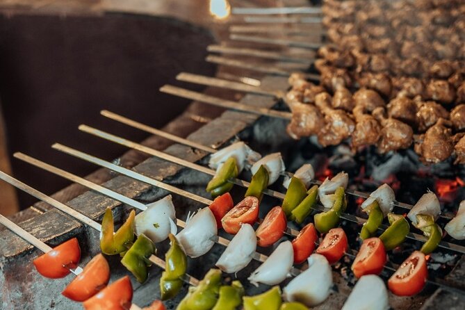 Deluxe Sunset Desert Safari: SandSurfing, Camel Ride & BBQ dinner - Arabic Coffee, Dates, and Camp Arrival