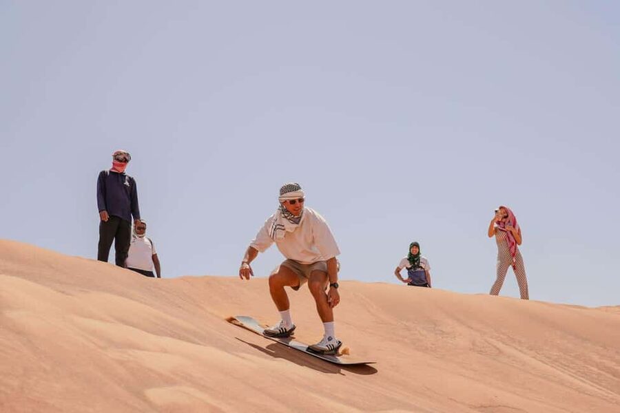 Desert Safari Dubai with Camel Ride, Sandboarding & Dinner - Dune bashing in a 4x4 Land Cruiser