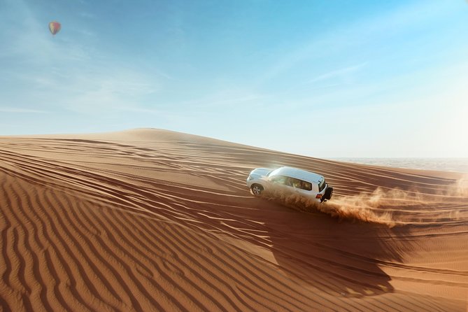 Desert Safari Dubai with Dune Bashing, Sandboarding, Camel Ride, 5 Shows, Dinner - A six-hour escape from Dubai’s towers