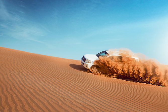 Desert Safari Dubai with Dune Bashing, Sandboarding, Camel Ride, 5 Shows, Dinner - Sandboarding, camel riding, and sunset photographs