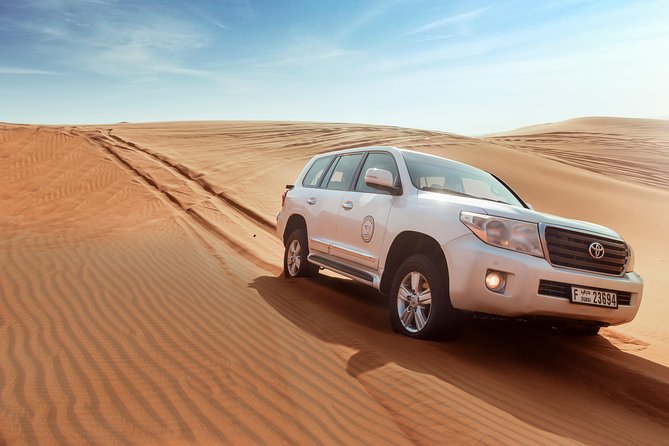 Desert Safari Dubai with Dune Bashing, Sandboarding, Camel Ride, 5 Shows, Dinner - Tea, luqaimat, henna, and Arabic dress photos