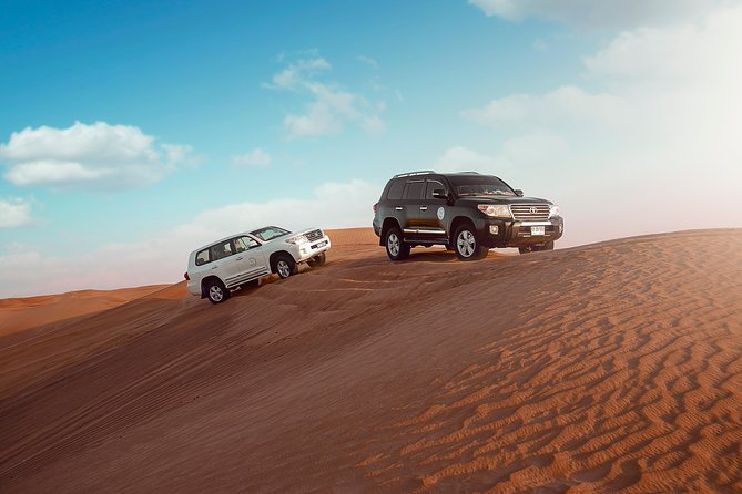 Desert Safari Dubai with Dune Bashing, Sandboarding, Camel Ride, 5 Shows, Dinner - The 25 to 30-minute dune-bashing ride