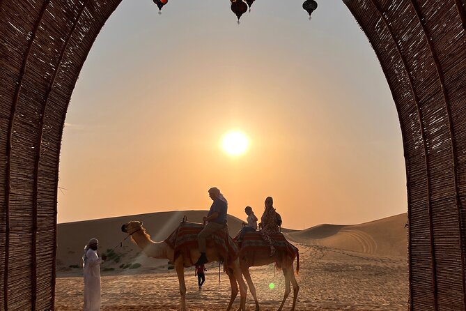 Desert Safari with Dune Bashing and Camel Ride plus Sand Boarding - Sunset photos with a helpful guide