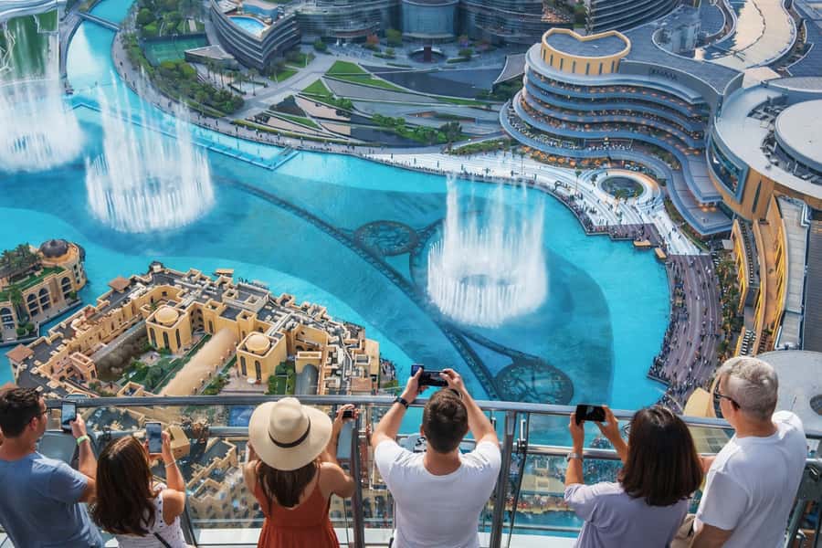 Dubai: 4-Hour Tour with Burj Khalifa Tickets - Crossing Dubai Creek toward the spice and gold souks