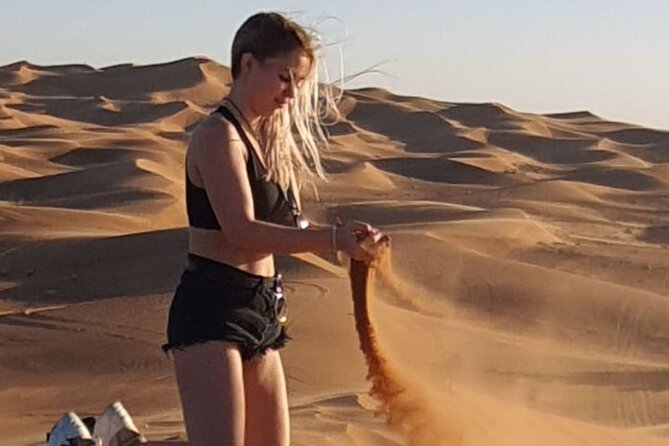 Dubai Desert Safari & Buffet Dinner and Camel ride with PRIVATE CAR - The shared Bedouin camp after dark
