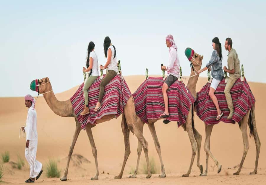 Dubai: Desert Safari, Camel Ride, Sandboard & Buffet Dinner - Henna, coffee, and small cultural touches