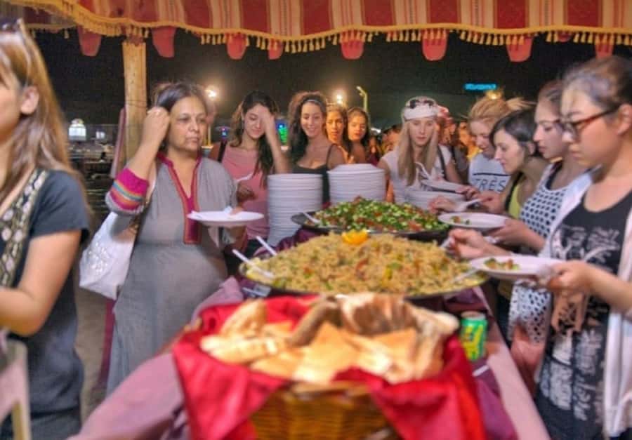 Dubai: Desert Safari Camel Riding, Sandboarding & BBQ Dinner - The desert camp after dark