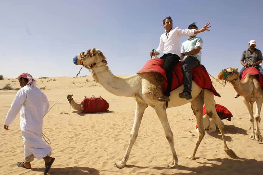 Dubai: Desert Safari, Quad Bike, Camel Ride and Sandboarding - Booking, Timing, and Cancellation