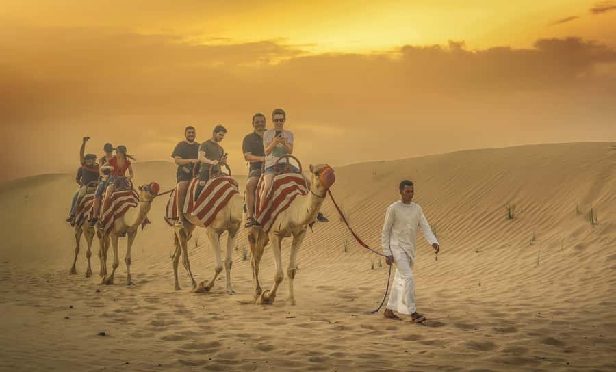 Dubai: Desert Safari, Quad Bike, Sandboarding, Camels & BBQ - Sandboarding on the Lehbab dunes