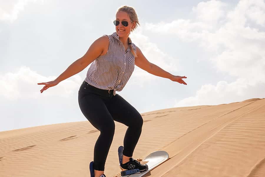 Dubai: Desert Safari, Quad Bike, Sandboarding, Camels & BBQ - BBQ dinner and evening entertainment