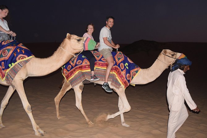 Dubai Desert Safari with BBQ, 3 Shows & Camel Ride at Majlis Camp - Camel riding, henna, and Arabic clothing