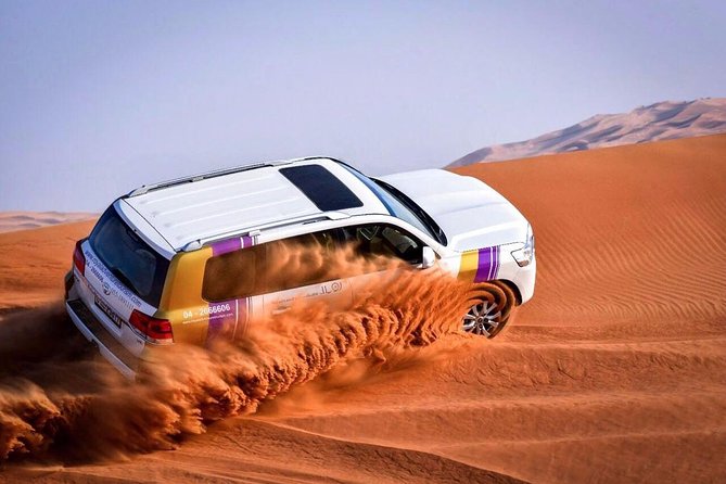 Dubai Desert Safari with BBQ And 4W Land Cruiser Dune Bashing Experience - From Dubai’s Towers to Open Sand