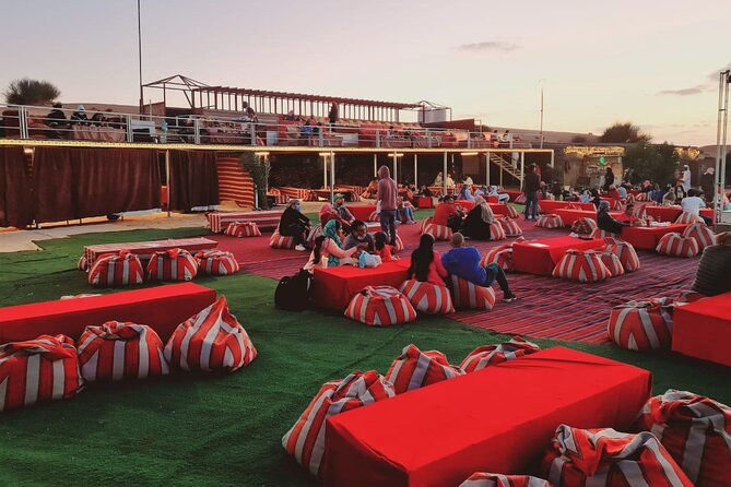 Dubai Desert Safari with Quad Bike, Camel Ride, Dinner and Show - Camel riding, henna, and the Bedouin-style camp