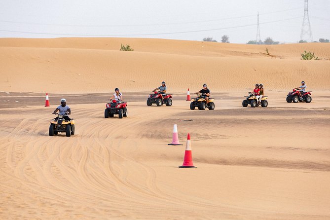 Dubai Desert Safari with Quads, BBQ Dinner, Camel ride, & Shows - Camel riding, sand art, and henna