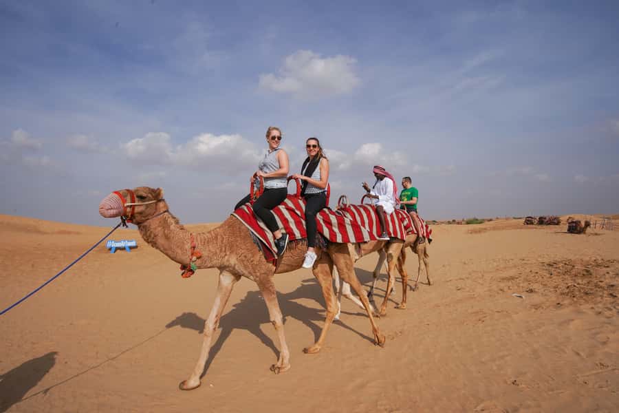 Dubai: Dune Buggy Desert Safari, Camel Ride & Sandboarding - Sandboarding on the dune slopes