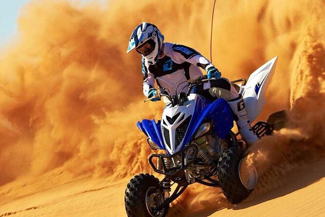 Dubai Evening 4x4 Desert Safari ATV Bike ,Camel Ride , BBQ Dinner - Quad bikes in a fenced desert area