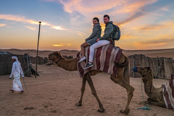 Dubai Evening Desert Safari, Camel Ride, Sandboarding & BBQ Dinner - Sandboarding with a practical footwear tip
