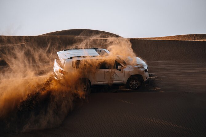 Dubai Evening Desert Safari: Sandboarding, BBQ, Camel Ride & more - Dune bashing across the reserve