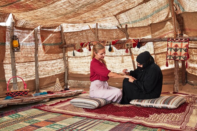 Dubai Evening Heritage Safari by Vintage G Class Al Marmoom Oasis - Arabic coffee, flatbread, and Emirati clothing