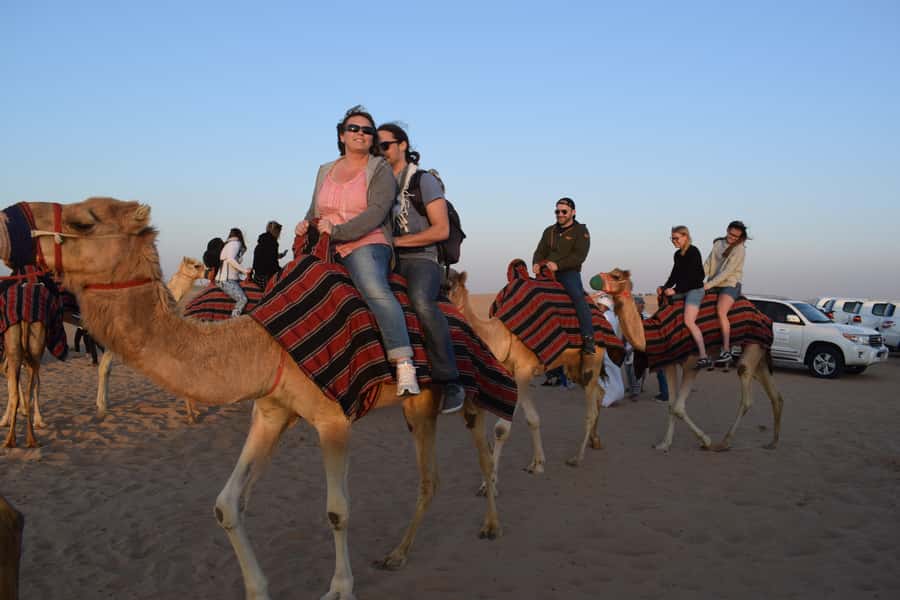Dubai: Evening Tour with Quad Biking, Camel Ride, and BBQ - From Dubai hotels to the red dunes