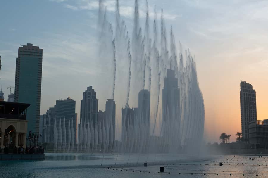 Dubai Full-Day Spanish Language Tour - City of Contrasts - The fabric souk and the abra across Dubai Creek