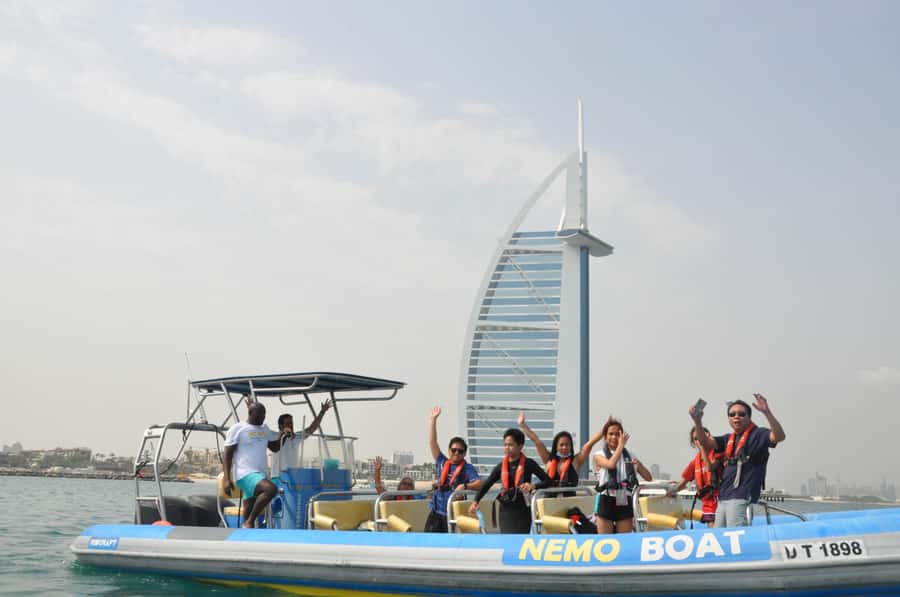 Dubai: Guided Speedboat Tour with City Sights & Ice Cream. - The guide makes a real difference