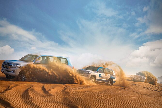 Dubai: Half-Day Desert Safari, Camels, Quad Bike & Refreshments - Dune bashing across the red sand