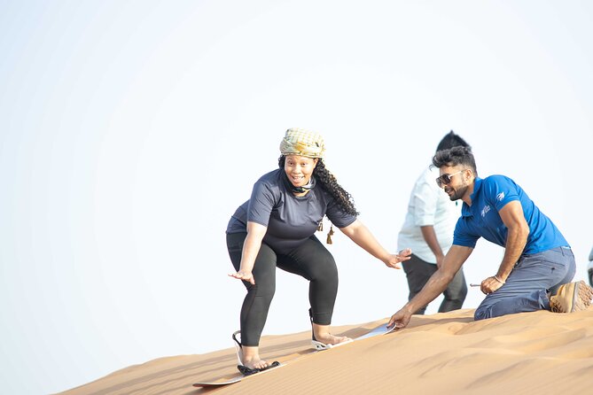 Dubai Half-day Red Dunes bashing with Sandboarding, Camel &Falcon - Sandboarding after the main ride
