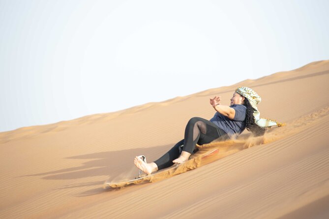 Dubai Half-day Red Dunes bashing with Sandboarding, Camel &Falcon - Falcon photographs, Arabic dress, and henna
