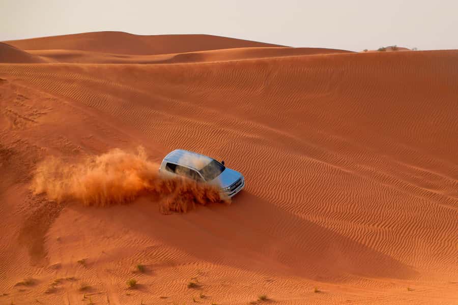 Dubai: Helicopter Ride, Desert Safari, Camels & Refreshments - From Dubai hotel pickup to Lahbab’s red dunes