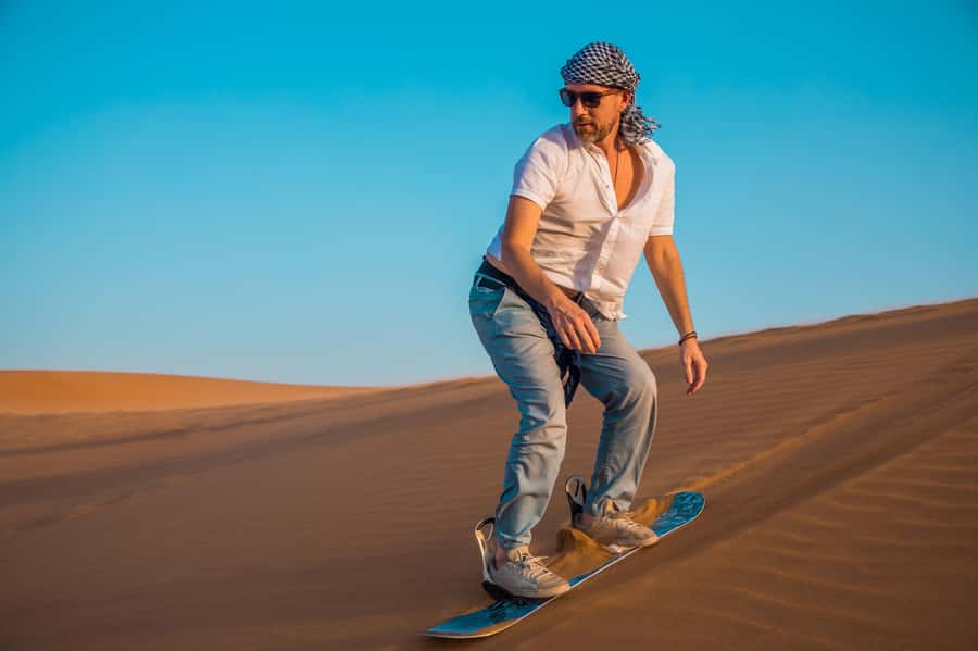 Dubai: Helicopter Ride, Desert Safari, Camels & Refreshments - Dune bashing, with a short sandboard stop