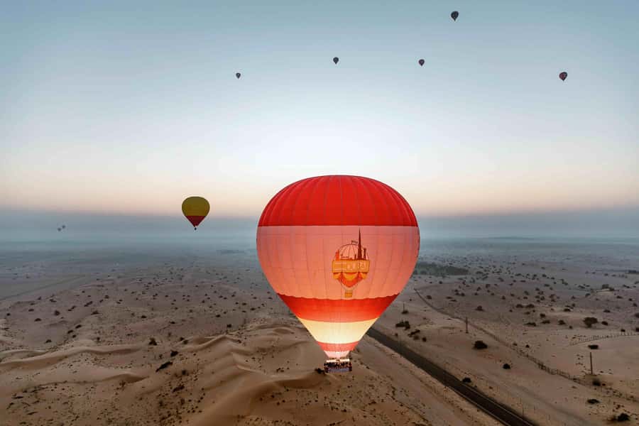 Dubai: Hot Air Balloon, Desert Safari, and Quad Biking Tour - Watching the balloon rise before takeoff