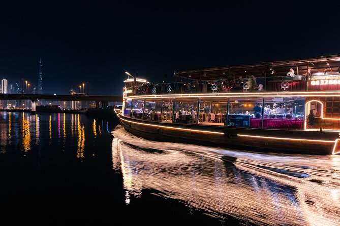 Dubai Luxury Canal Dinner Cruise with Optional Transfer - Passing under the Sheikh Zayed Road waterfall
