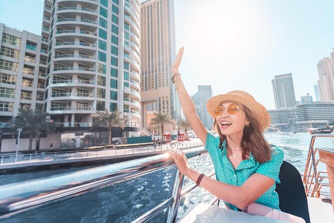 Dubai Marina Dhow Sightseeing Cruise - Boarding a traditional dhow in a modern marina