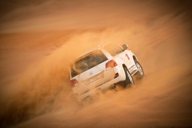 Dubai Morning Desert Safari with Quad Biking & More Activities - Sandboarding for a simple desert thrill