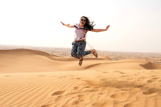 Dubai Morning Safari: Quad Biking, Sandboarding & Camel Ride! - Dune bashing across the red sand