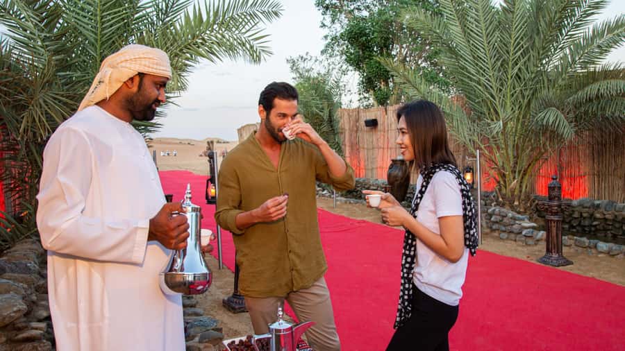 Dubai: Premium Desert Safari, Camel Ride, BBQ & Sandboarding - A premium Bedouin-style camp after dark