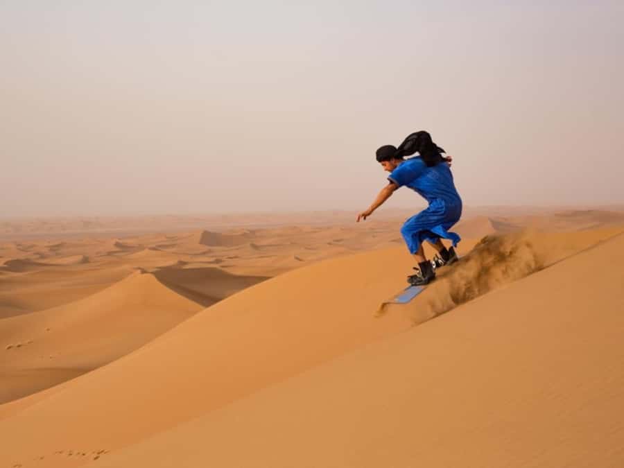 Dubai: Private Dune Buggy, Camel Ride, and Sand Boarding! - Meeting John the camel after the ride