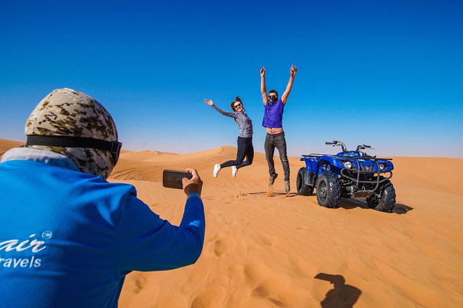 Dubai Red Dunes ATV, Camels, Stargazing & 5<em> BBQ Al Khayma Camp – Key points to know before booking’ /></p>
<ul>
<li><strong>Red dunes and a full hour on the ATV:</strong> You ride across Lahbab’s orange-red sand after a safety briefing, with a guide leading the route.</li>
<li><strong>Al Khayma Camp is the evening centerpiece:</strong> Arabic coffee, dates, camel rides, henna, falcon photos, local dress, shisha, dinner, shows, and stargazing are included.</li>
<li><strong>The $88 price covers a lot:</strong> Transfers, helmet, fuel, guide, ATV session, food, soft drinks, and listed camp activities are part of the package.</li>
<li><strong>Evening is the better choice for atmosphere:</strong> Fire shows and stargazing are reserved for evening departures. The 11:30 AM slot has lunch but not those two features.</li>
<li><strong>The ATV is not a casual amusement ride:</strong> You must be over 14, know the basics of driving, sign an indemnity form, and accept responsibility for damage or injury.</li>
<li><strong>Expect about six hours door to door:</strong> Pickup is usually around 45 minutes before departure, and the drive back to Dubai takes about an hour.</li>
</ul>
<h2>From Dubai hotels to the red dunes of Lahbab</h2>
<p><img width="669" height="446" decoding="async" src=