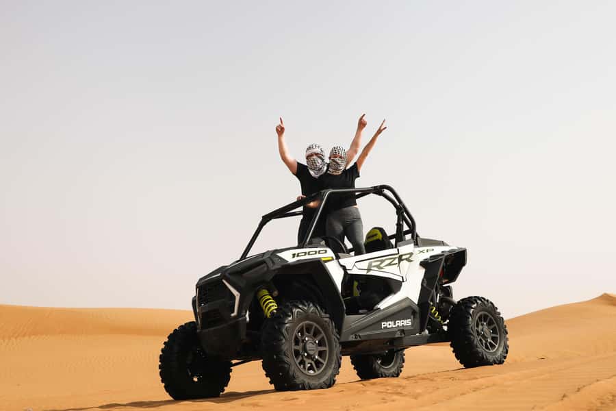 Dubai: Red Dunes Quad Bike, Dune Buggy, Camel & Refreshments - Sandboarding on the midway stop